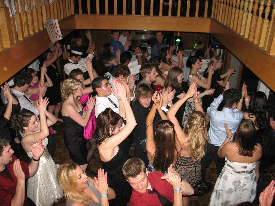 A lively scene of people dancing in a room, showcasing the vibrant atmosphere of MSU clubs