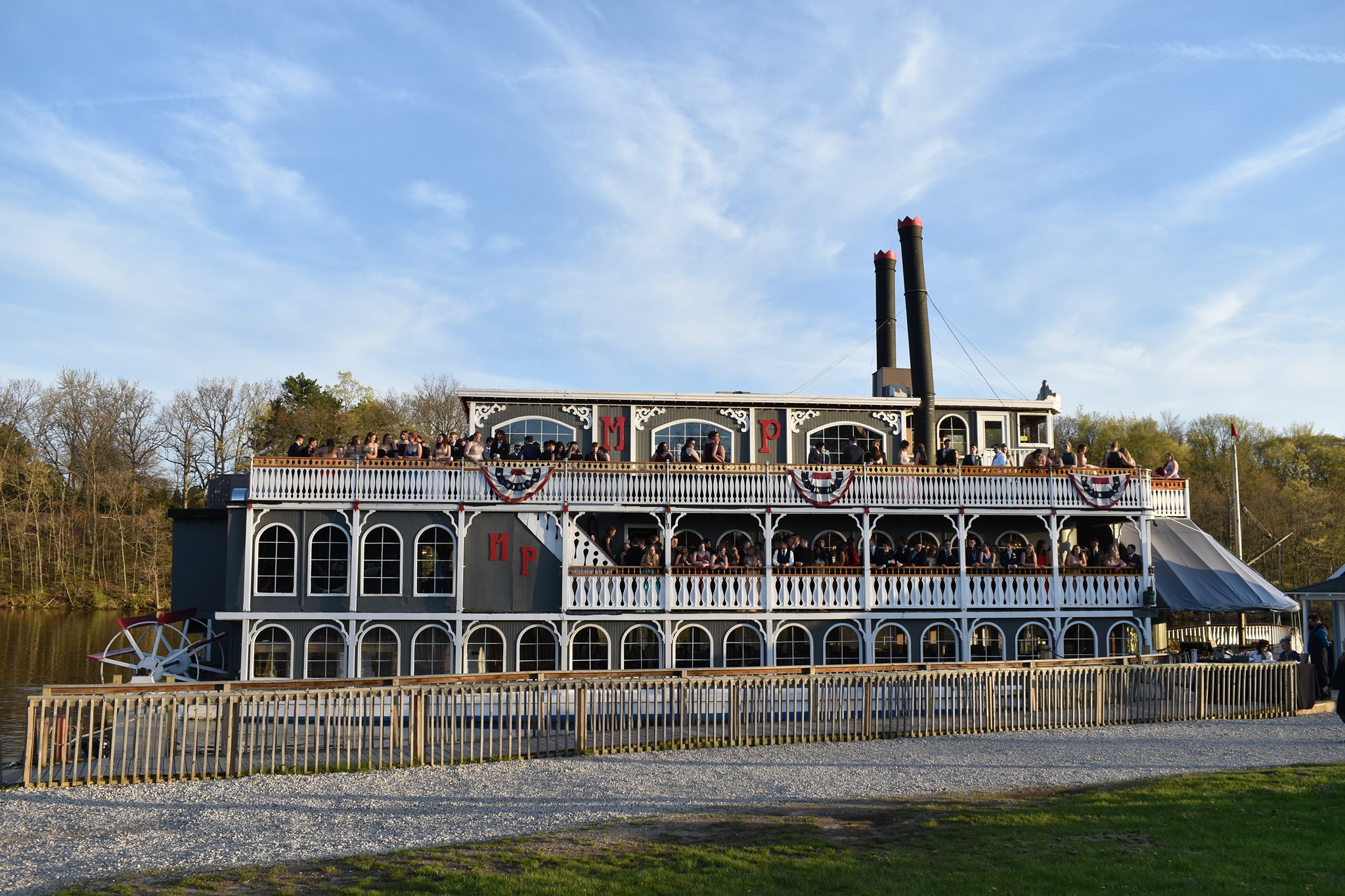 Michigan Princess Riverboat docked, showcasing its multi-deck structure, ready for a prom event.